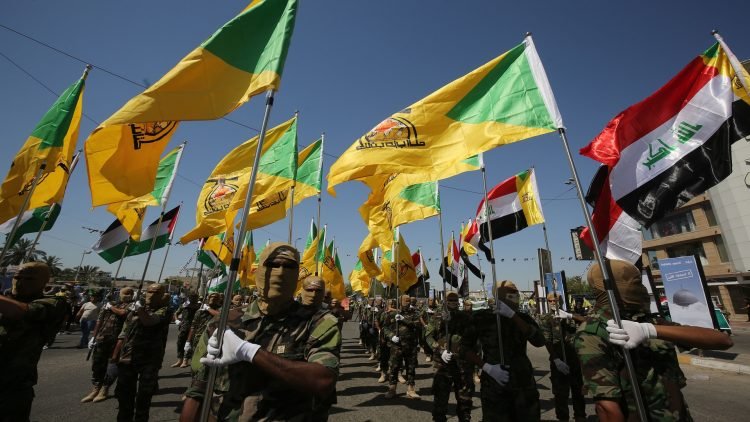 Iraqi Shiite fighters from the Iran-backed armed group, Hezbollah brigades, march during a military parade marking Al-Quds (Jerusalem) International Day in Baghdad, on May 31, 2019. - An initiative started by the late Iranian revolutionary leader Ayatollah Ruhollah Khomeini, Quds Day is held annually on the last Friday of the Muslim fasting month of Ramadan and calls for Jerusalem to be returned to the Palestinians . (Photo by AHMAD AL-RUBAYE / AFP) (Photo credit should read AHMAD AL-RUBAYE/AFP via Getty Images)