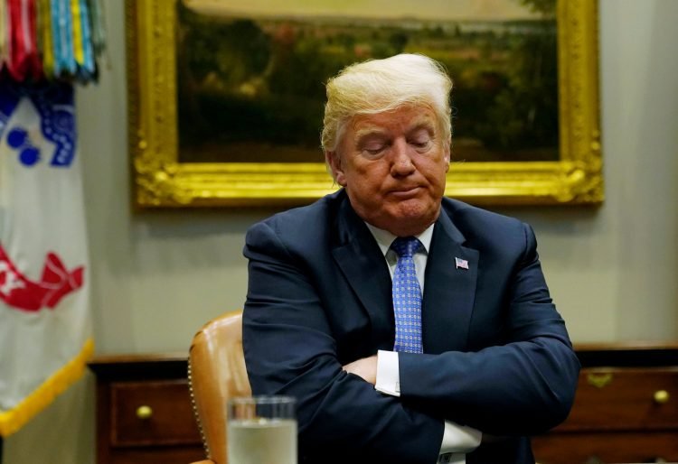 U.S. President Donald Trump reacts while holding a roundtable on the Foreign Investment Risk Review Modernization Act at the White House in Washington, U.S., August 23, 2018. REUTERS/Kevin Lamarque