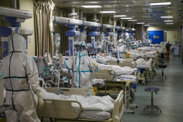 Medical workers in protective suits attend to novel coronavirus patients at the intensive care unit (ICU) of a designated hospital in Wuhan, Hubei province, China February 6, 2020. Picture taken February 6, 2020. China Daily via REUTERS ATTENTION EDITORS - THIS IMAGE WAS PROVIDED BY A THIRD PARTY. CHINA OUT. - RC2UWE9N0S1O