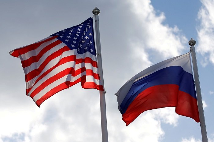FILE PHOTO: Russian and U.S. state flags fly near a factory in Vsevolozhsk, Leningrad Region, Russia March 27, 2019. REUTERS/Anton Vaganov