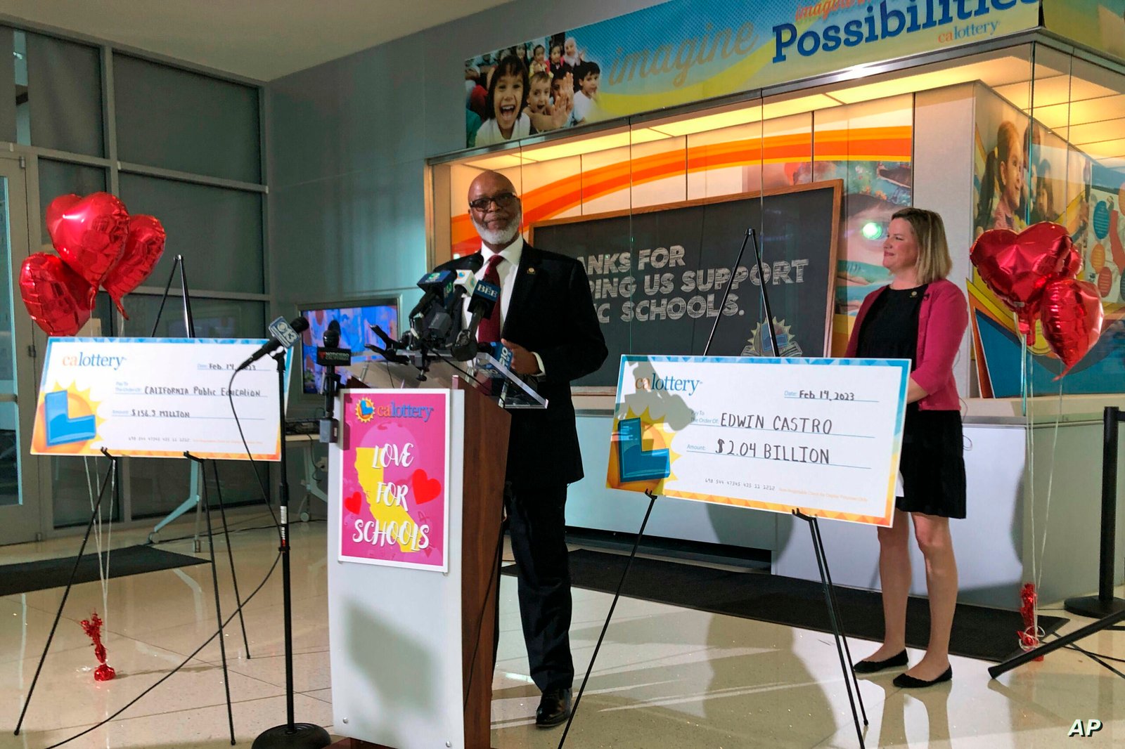California Lottery Director Alva Johnson announces that Edwin Castro won November's record-high $2.04 billion PowerBall jackpot on Tuesday, Feb. 14, 2023, in Sacramento, Calif. Castro declined to appear at the news conference but said in a written statement he was shocked and ecstatic. The jackpot ticket was sold at Joe's Service Center in Altadena, an unincorporated foothill community northeast of Los Angeles. (AP Photo/Adam Beam)